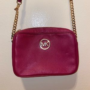 Original Michael Kors berry cross body bag.